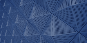 Close-up of a blue, perforated surface with repeating triangular patterns